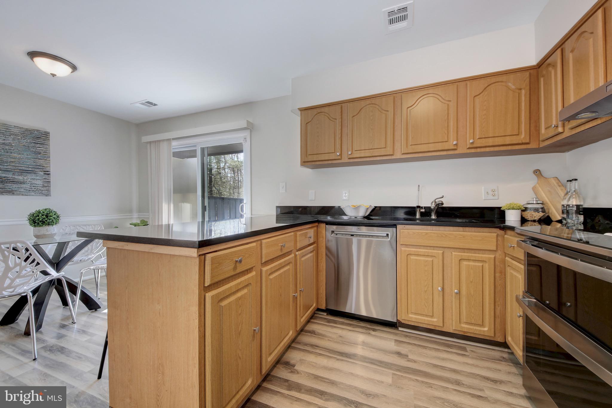 2235 Cartwright Place Reston, VA 20191 - Photo 7 of 43 Granite countertops & stainless appliances