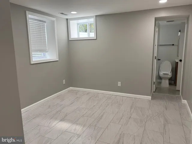 a view of an empty room with a bathroom