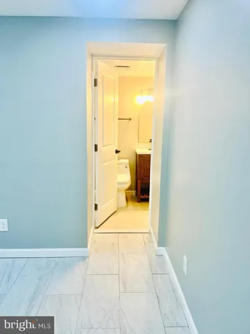 a view of a bathroom with a shower and a toilet