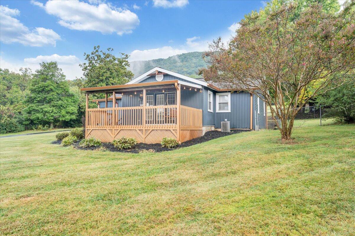 4515 Yellow Mountain Road Roanoke, VA 24014 - Photo 1 of 52 a view of a house with a yard and sitting area