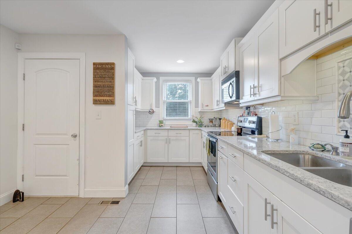 4515 Yellow Mountain Road Roanoke, VA 24014 - Photo 23 of 52 a kitchen with a sink and cabinets