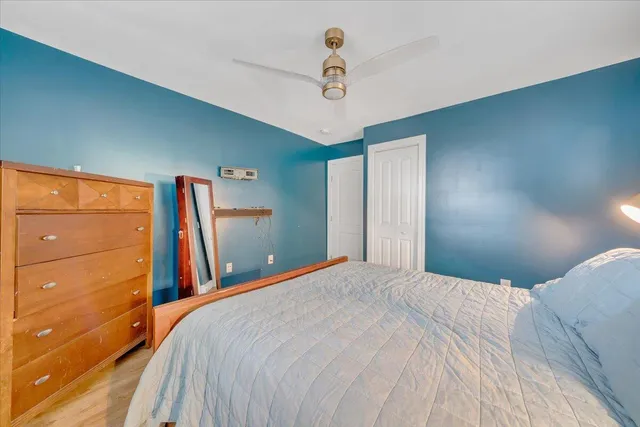 a bedroom with a bed and a dresser