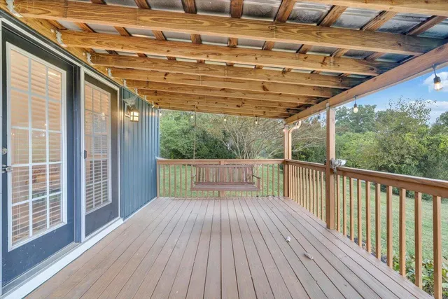 a view of porch with wooden floor