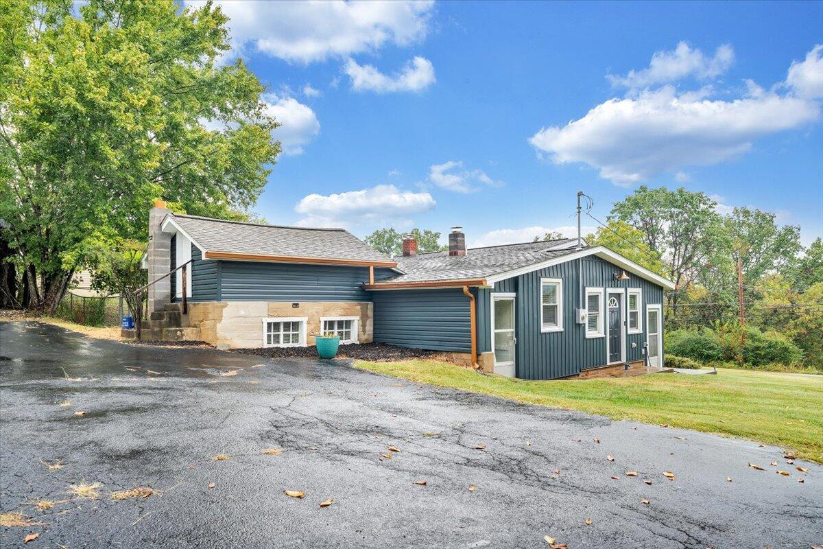 4515 Yellow Mountain Road Roanoke, VA 24014 - Photo 39 of 52 a view of a house with a patio and a yard