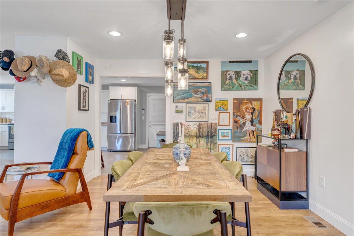 4515 Yellow Mountain Road Roanoke, VA 24014 - Photo 8 of 52 a dining room filled chandelier and wooden floor