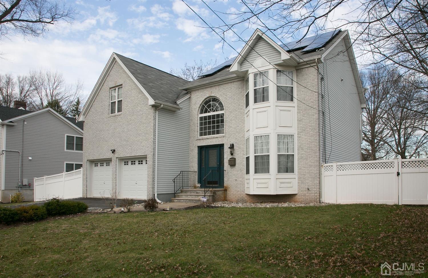 12 Lenox Street Edison, NJ 08817 - Photo 3 of 33 a front view of a house with a yard
