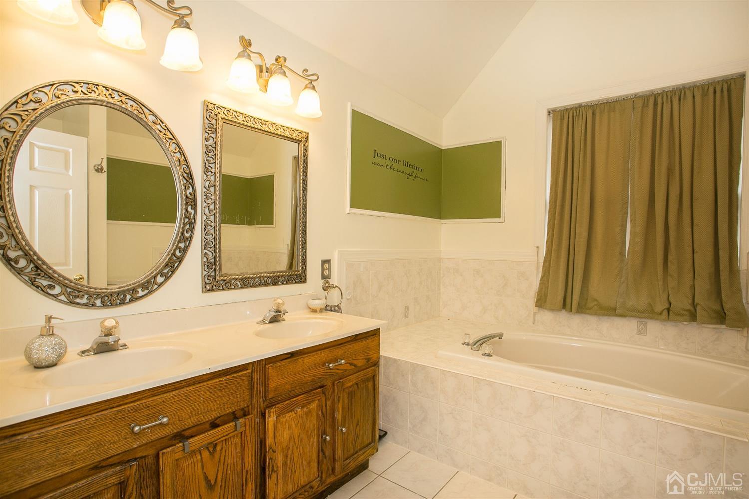 12 Lenox Street Edison, NJ 08817 - Photo 27 of 33 a bathroom with a sink and a mirror