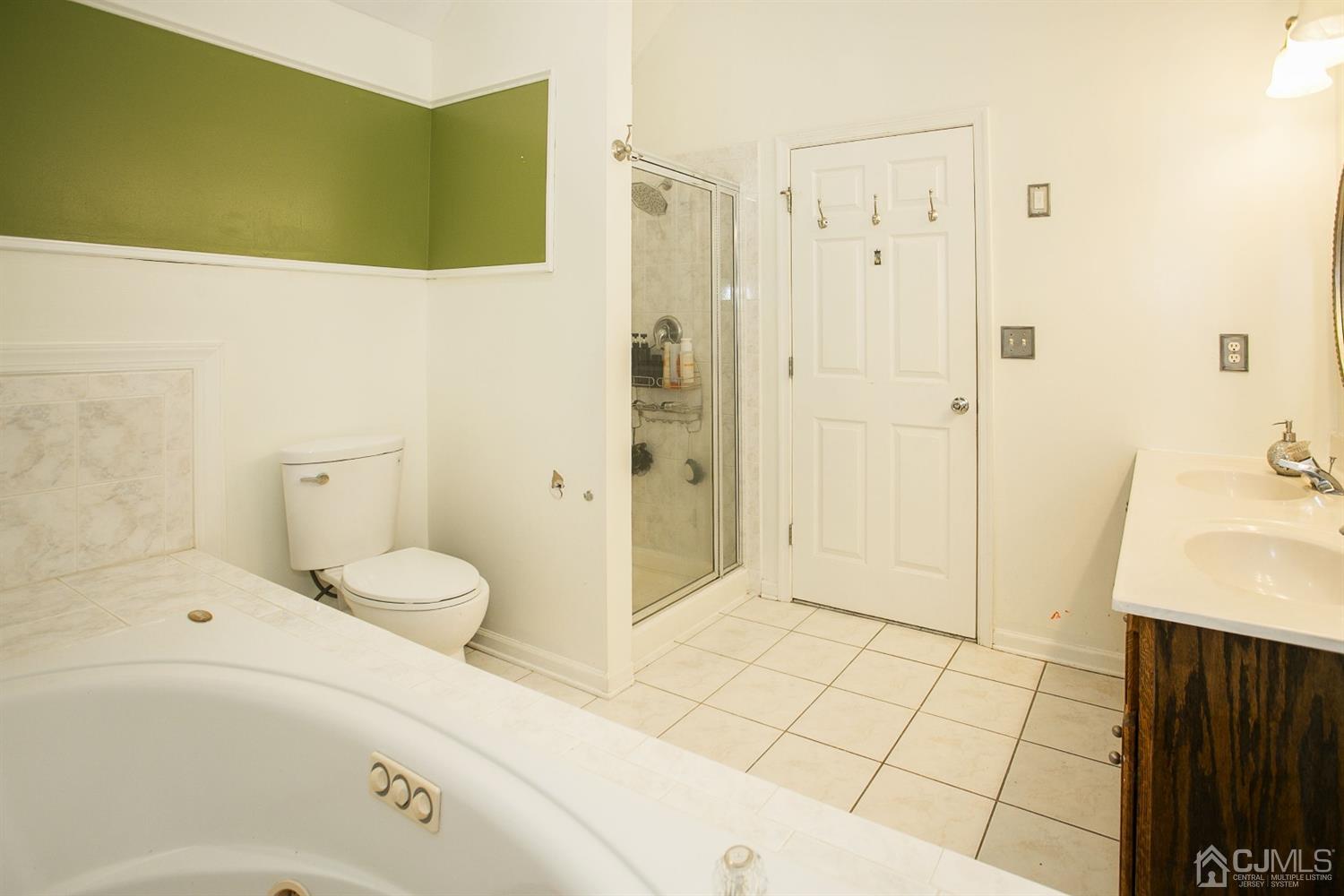 12 Lenox Street Edison, NJ 08817 - Photo 28 of 33 a bathroom with a sink and a mirror