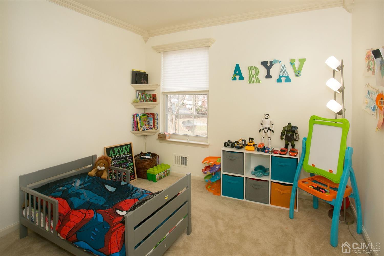 12 Lenox Street Edison, NJ 08817 - Photo 29 of 33 a bedroom with baby bed and window