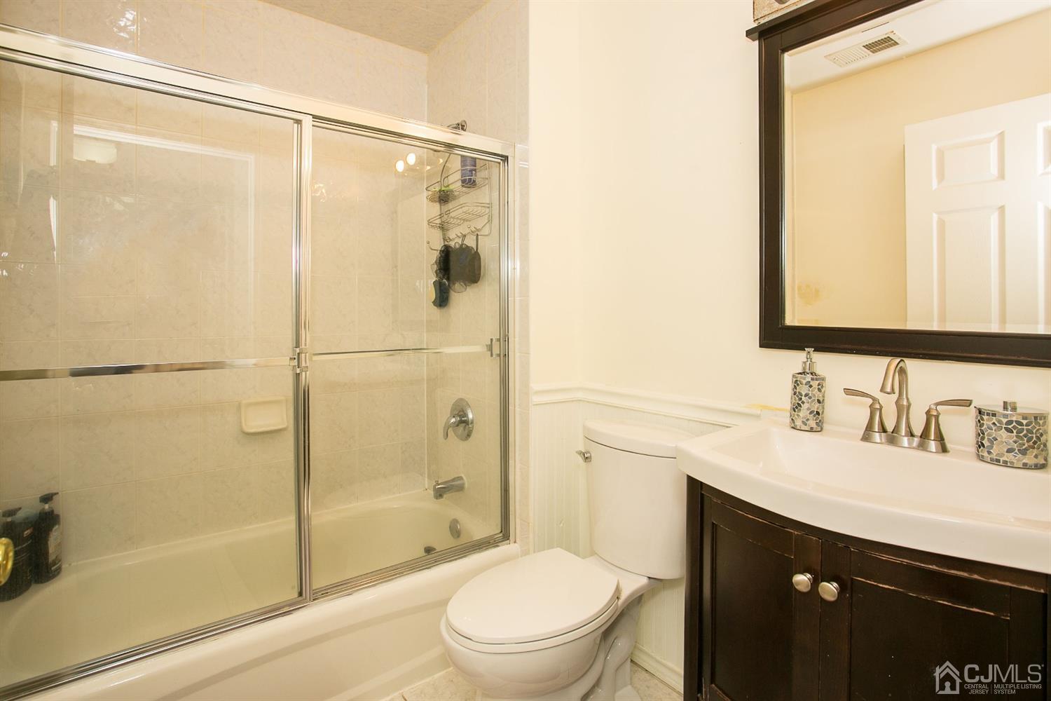 12 Lenox Street Edison, NJ 08817 - Photo 32 of 33 a bathroom with a sink a toilet and shower