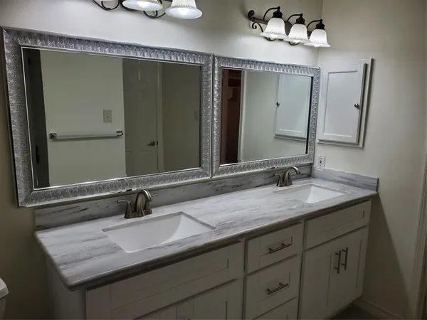 a bathroom with a sink and a mirror