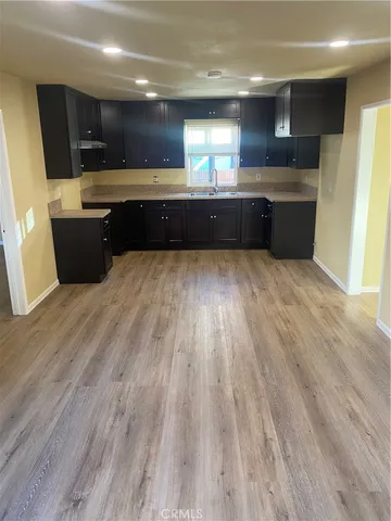 a kitchen with stainless steel appliances granite countertop a sink and cabinets