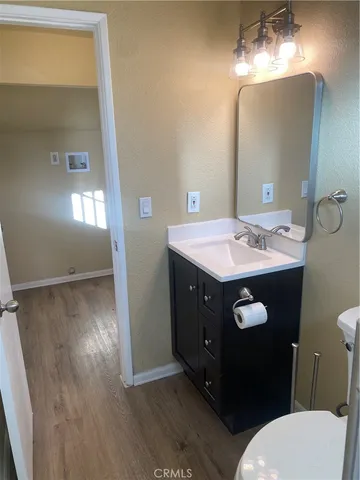 a bathroom with a sink vanity and a mirror