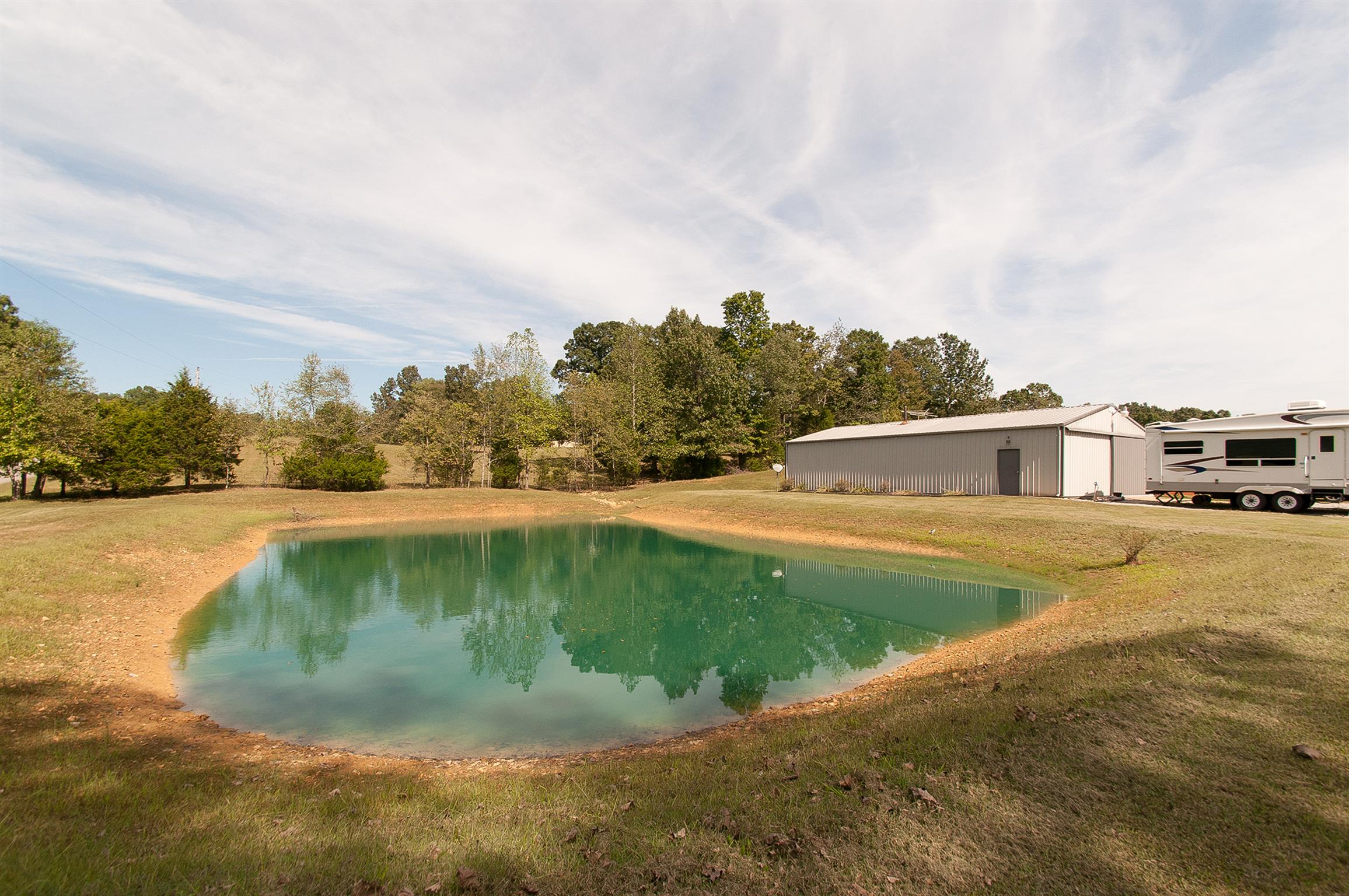 1830 Fortner Road Dickson, TN 37055 - Photo 19 of 23 Front pond and garage/work shop with man cave Man Cave could also be apartment