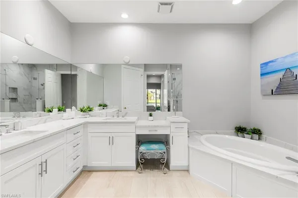 a spacious bathroom with a sink and a bathtub
