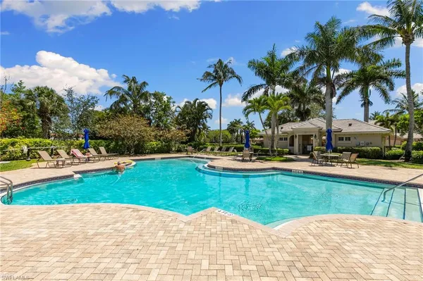 a view of a swimming pool with a patio