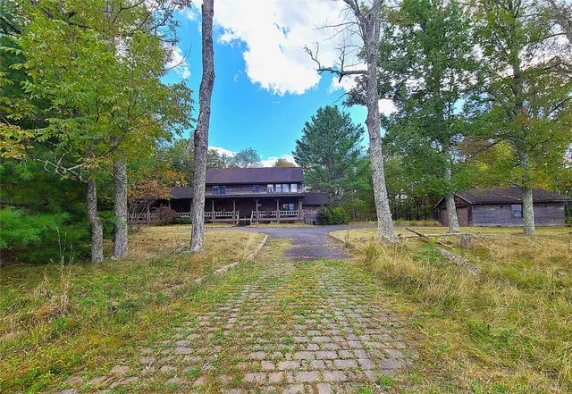 a view of a swimming pool and lounge chairs