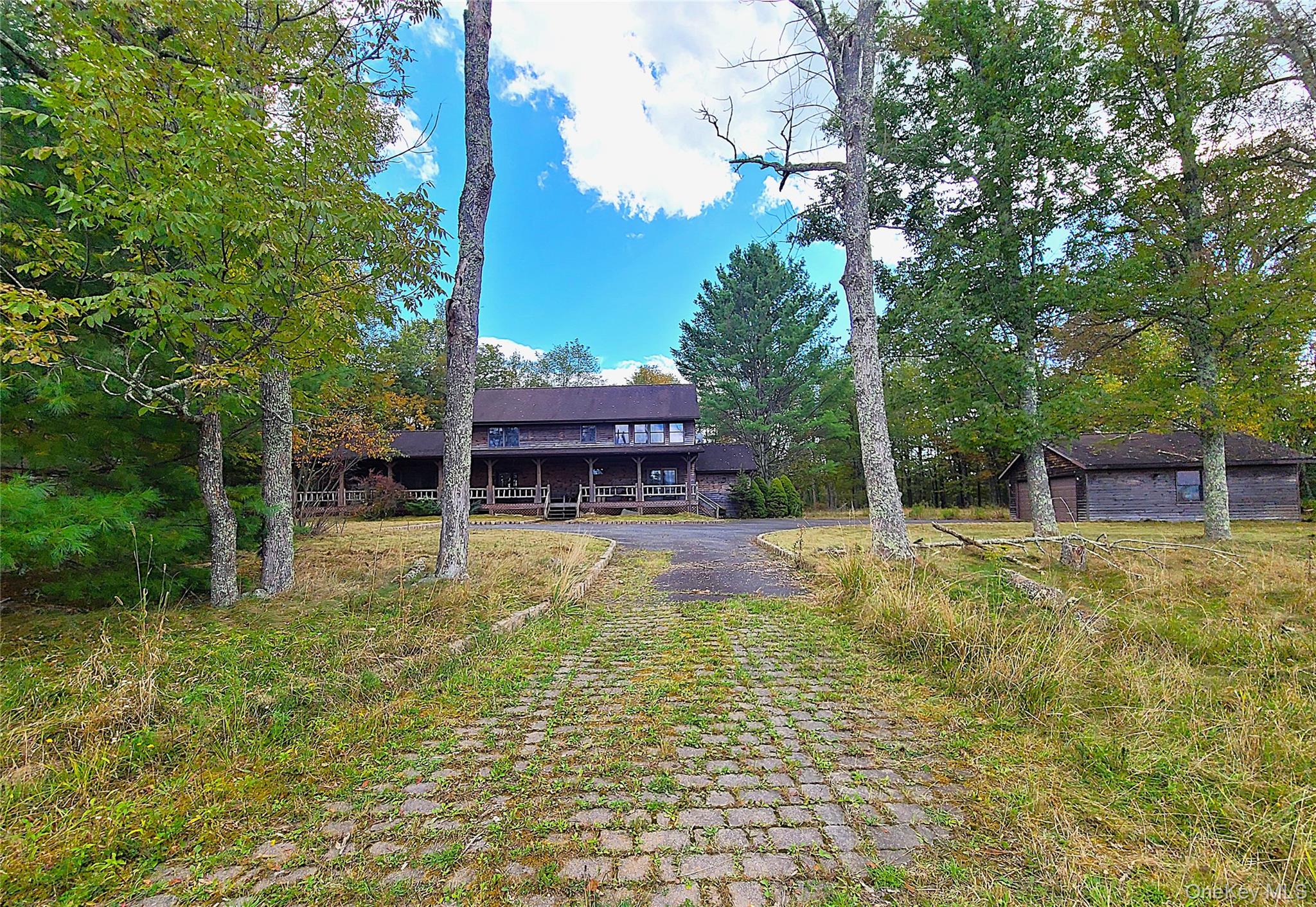118 Hilltop Road Monticello, NY 12701 - Photo 2 of 45 View of front of home with a deck
