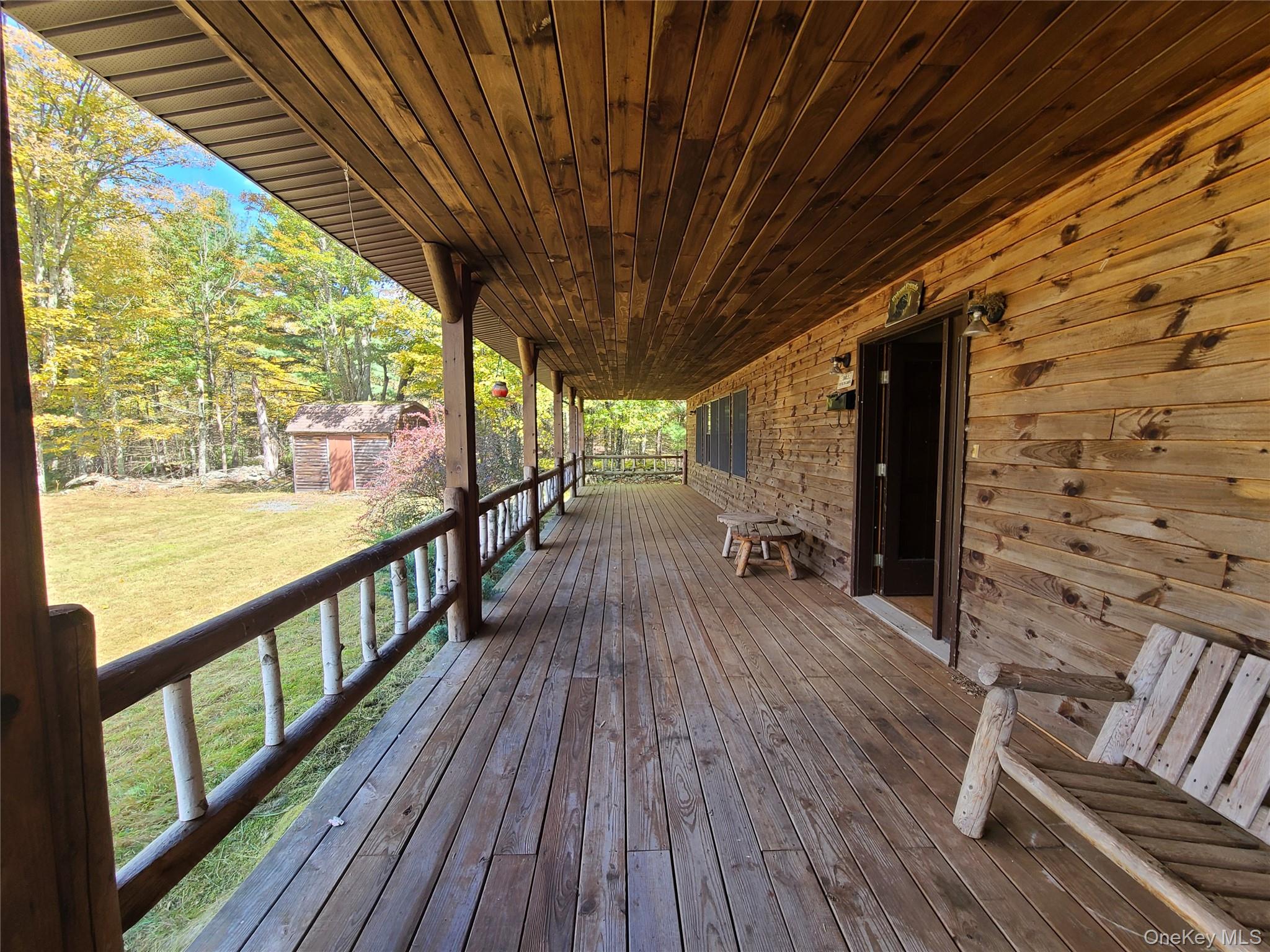 118 Hilltop Road Monticello, NY 12701 - Photo 23 of 45 a view of outdoor space with wooden floor and outdoor seating