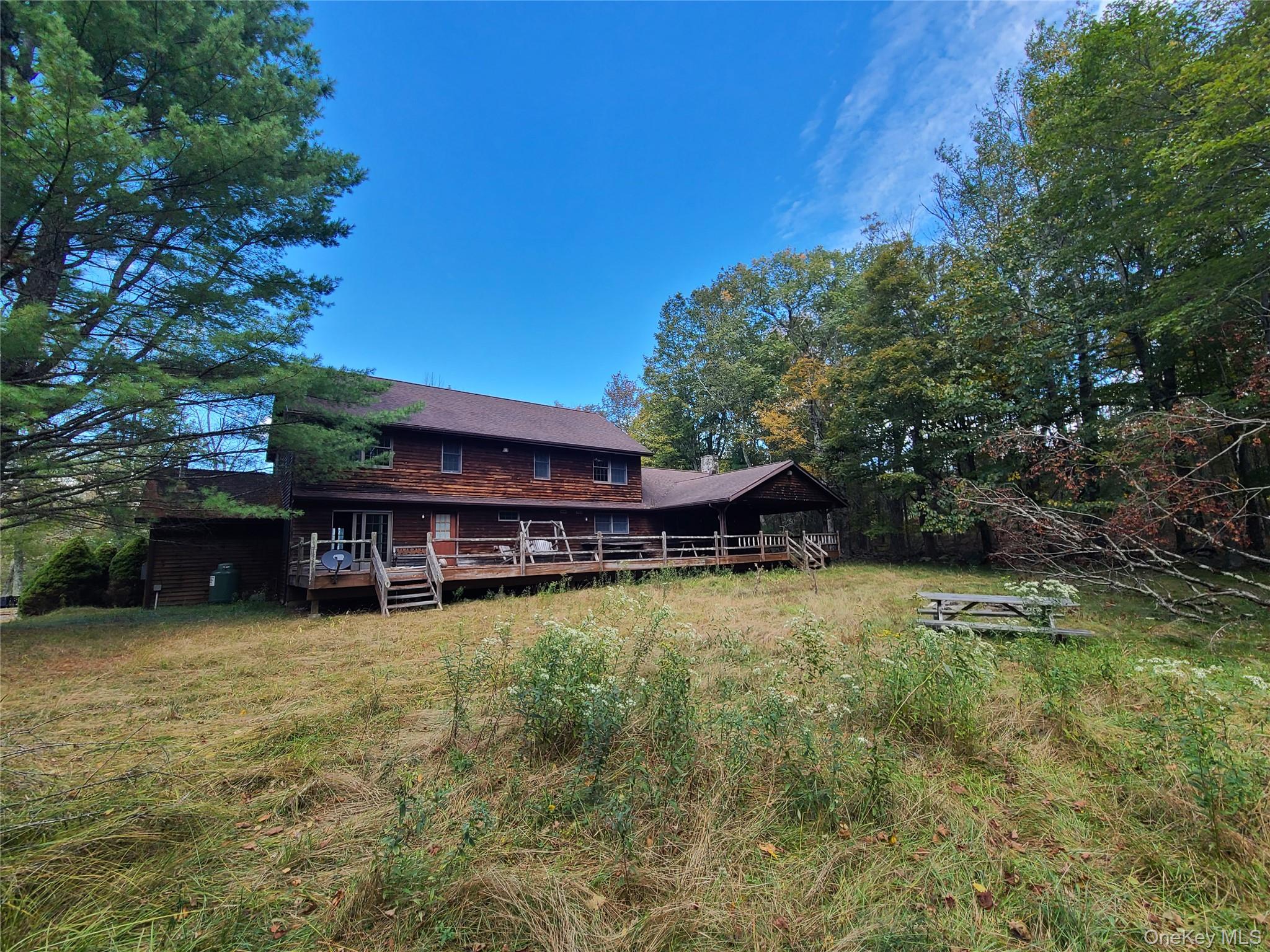 118 Hilltop Road Monticello, NY 12701 - Photo 6 of 45 a view of a swimming pool and lounge chairs