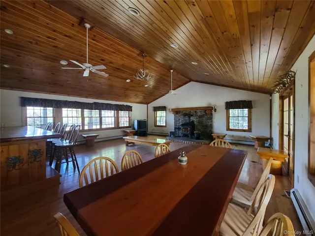 a view of a livingroom with fireplace and window