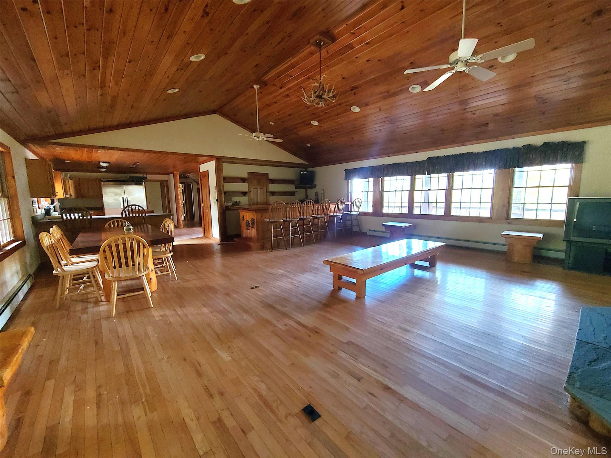 118 Hilltop Road Monticello, NY 12701 - Photo 8 of 45 a living room with furniture and a wooden floor