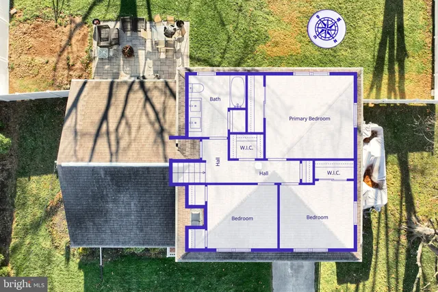 a front view of a house with garden and tree