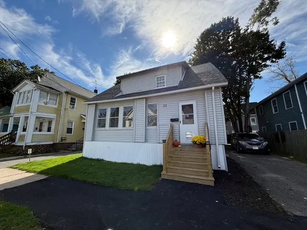 a front view of a house with a yard