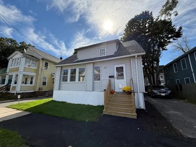a front view of a house with a yard