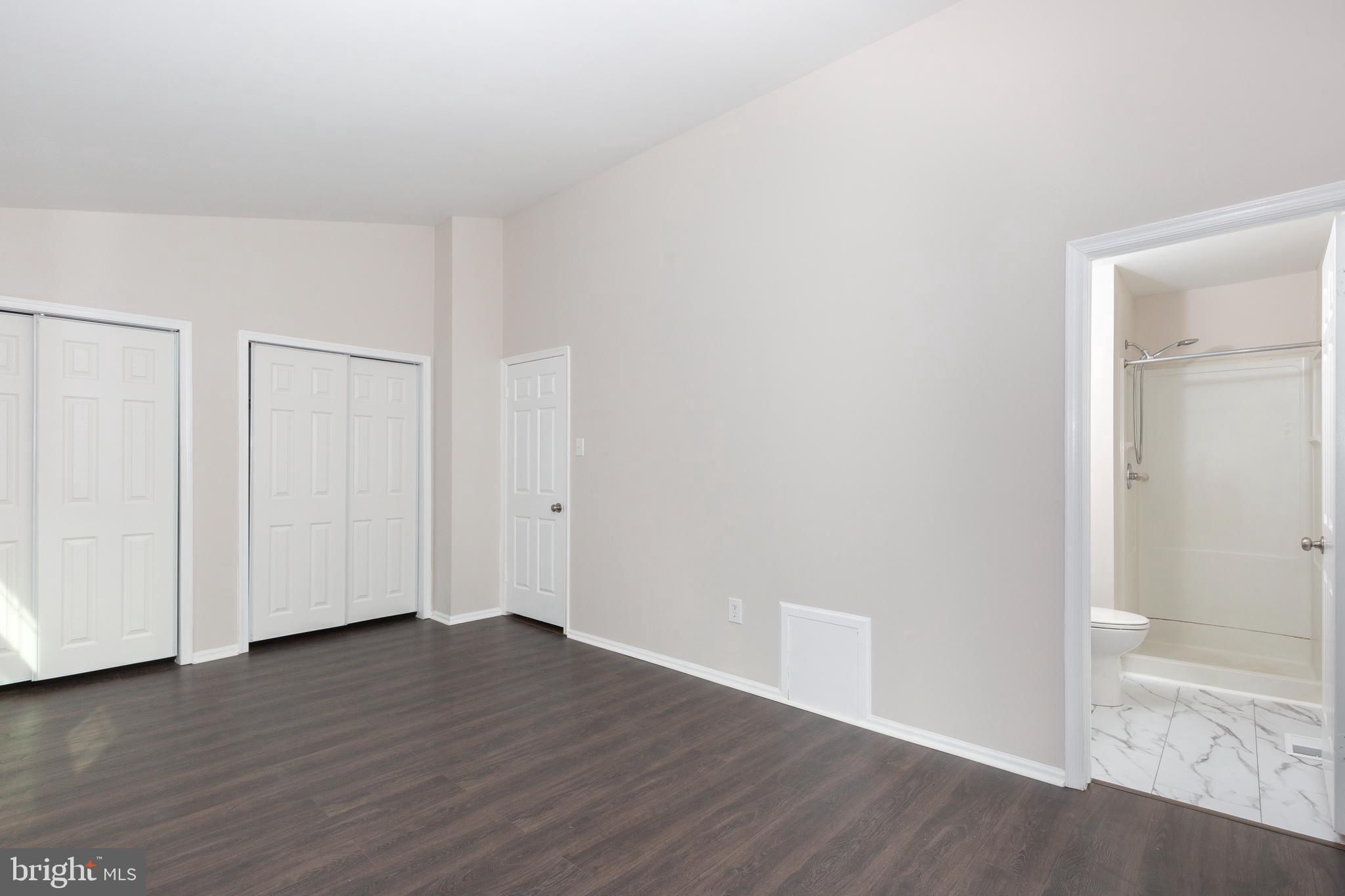 7459 Setting Sun Way Columbia, MD 21046 - Photo 20 of 33 a view of an empty room with wooden floor
