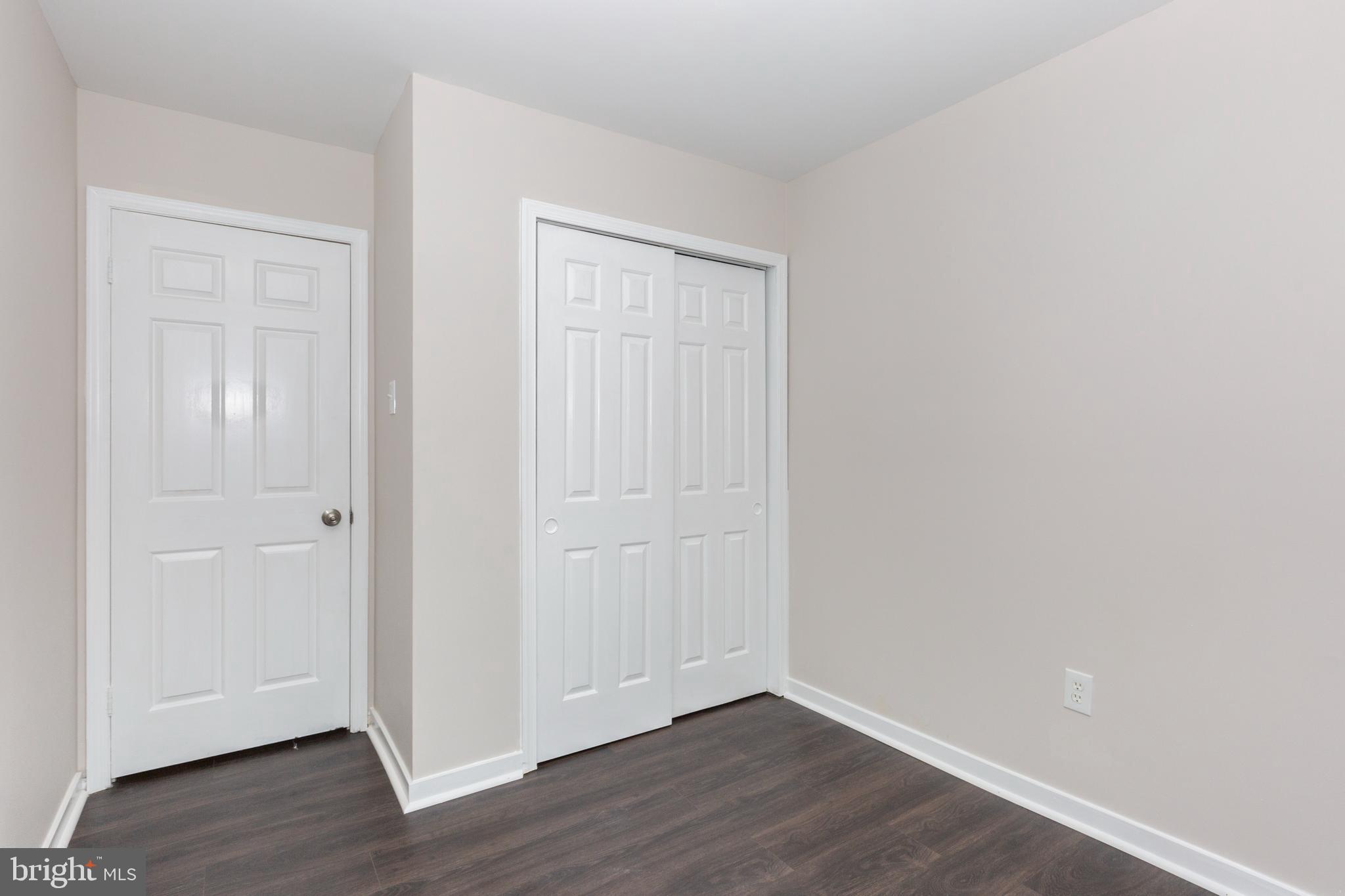 7459 Setting Sun Way Columbia, MD 21046 - Photo 21 of 33 a view of an empty room with wooden floor