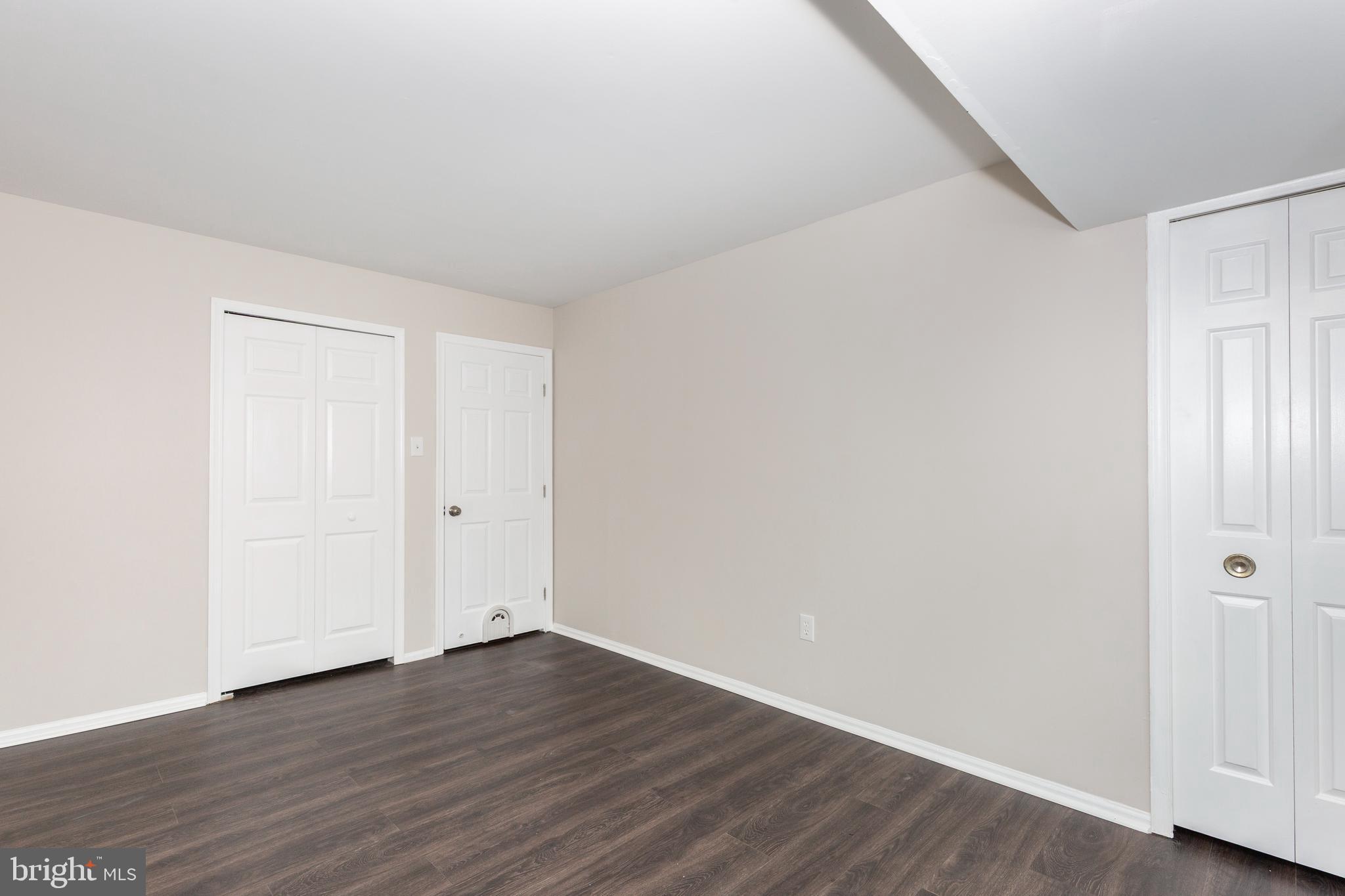 7459 Setting Sun Way Columbia, MD 21046 - Photo 22 of 33 a view of an empty room with wooden floor
