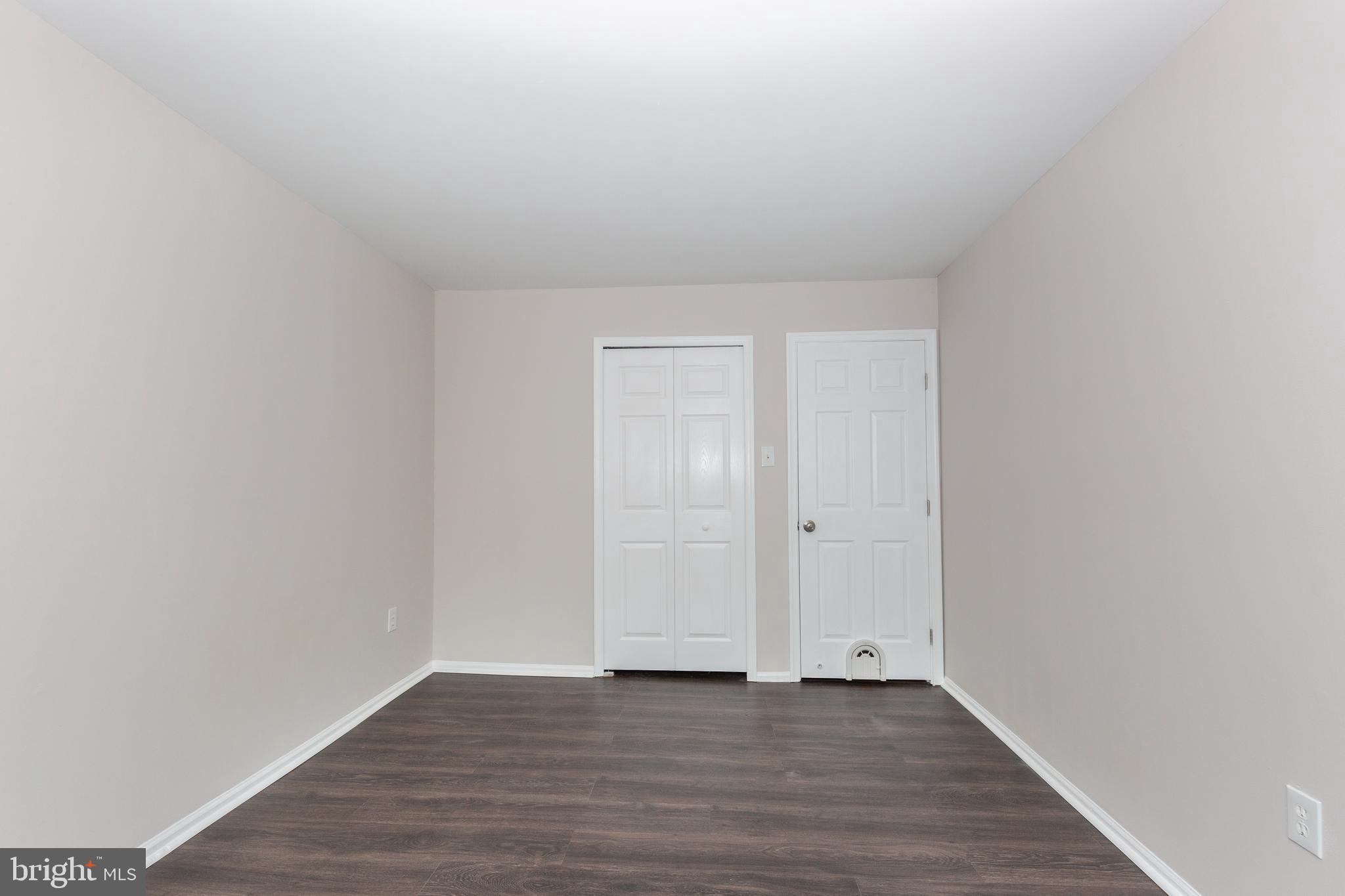 7459 Setting Sun Way Columbia, MD 21046 - Photo 23 of 33 a view of an empty room and wooden floor