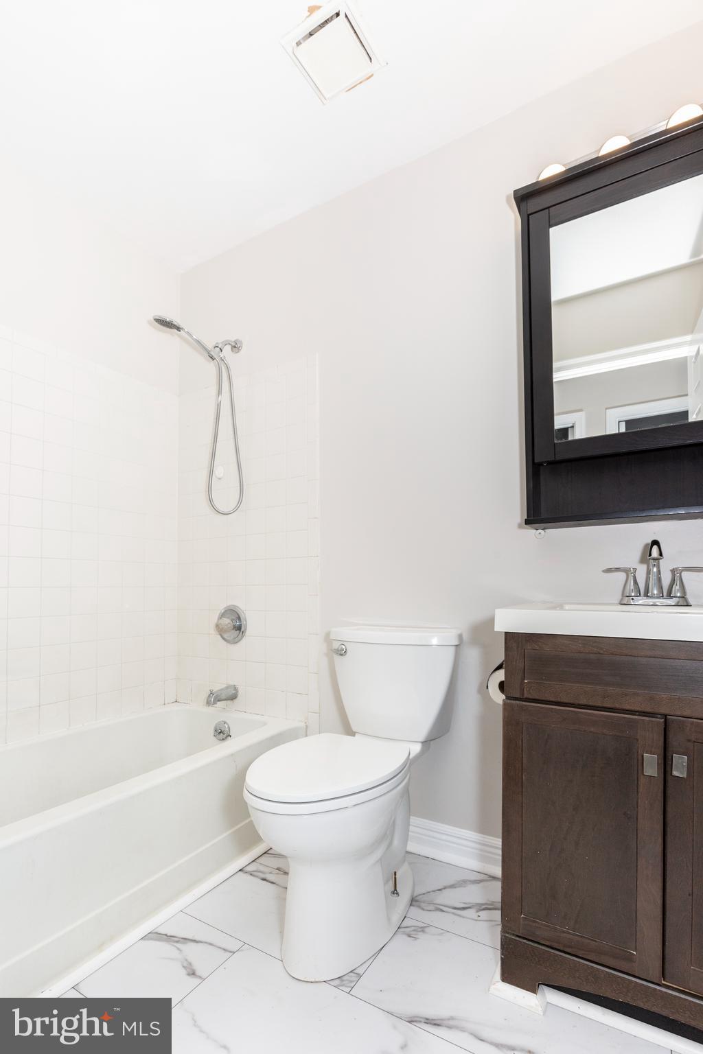 7459 Setting Sun Way Columbia, MD 21046 - Photo 25 of 33 a bathroom with a sink toilet and shower