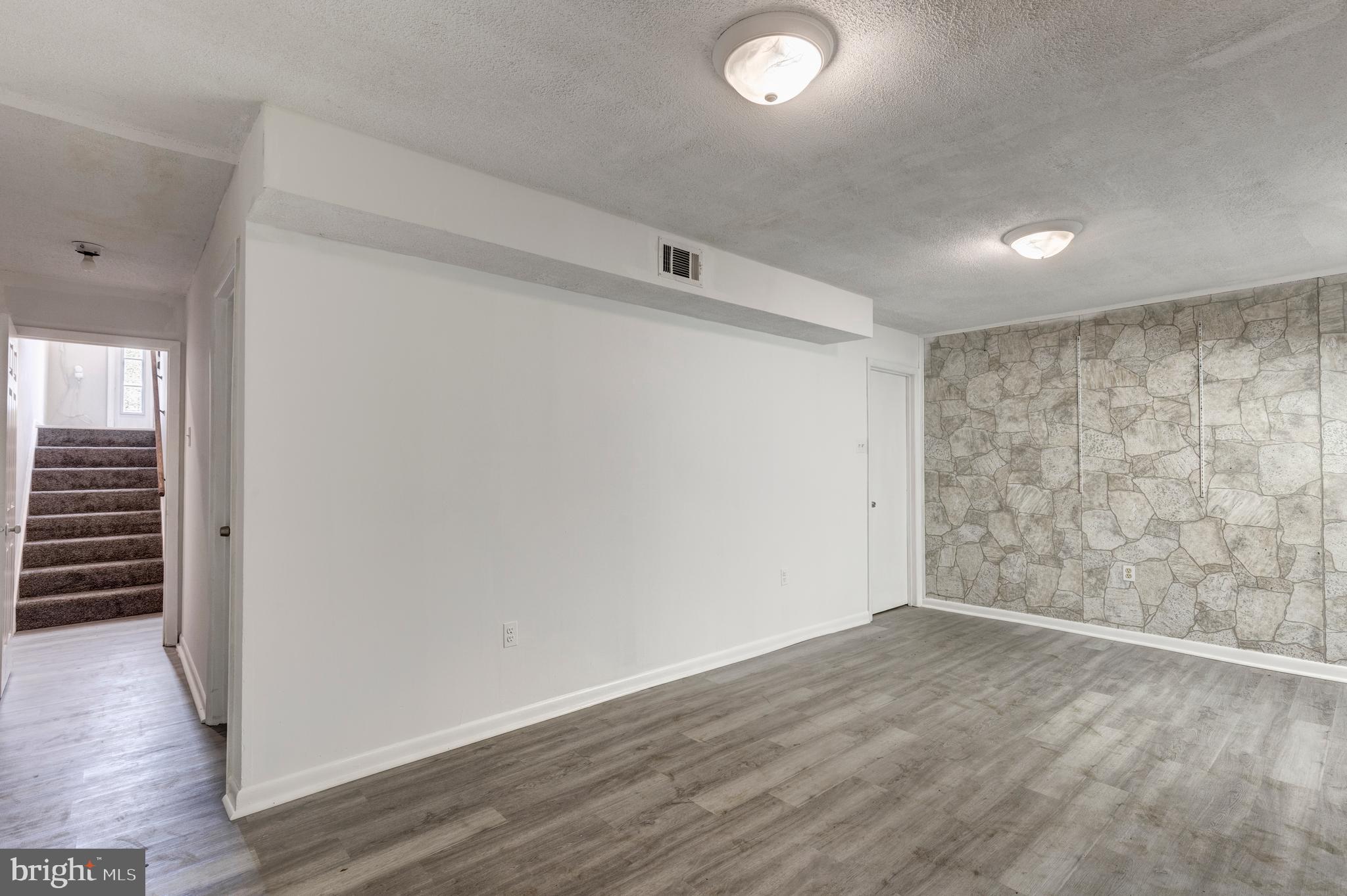 7459 Setting Sun Way Columbia, MD 21046 - Photo 30 of 33 an empty room with wooden floor and windows