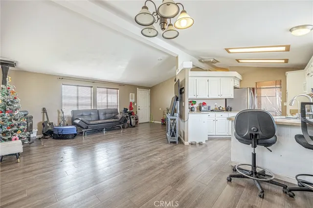 a bathroom with a granite countertop sink mirror vanity and toilet