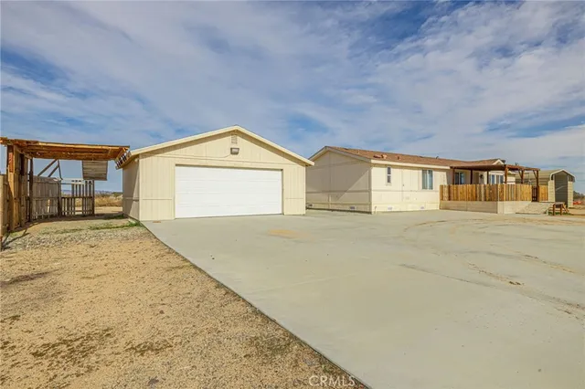 a view of room with furniture and wooden floor