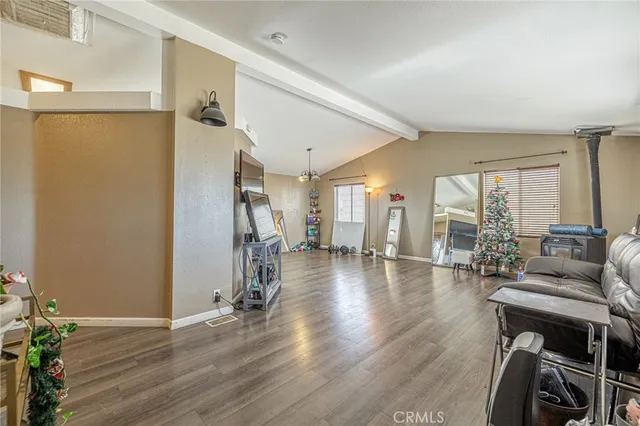 a kitchen with granite countertop cabinets table and chairs
