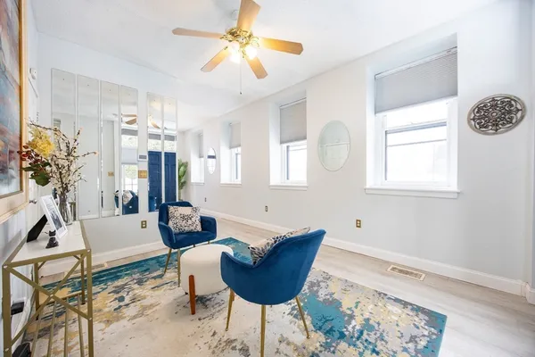 a kitchen with stainless steel appliances granite countertop a stove a sink a microwave a refrigerator and a stove