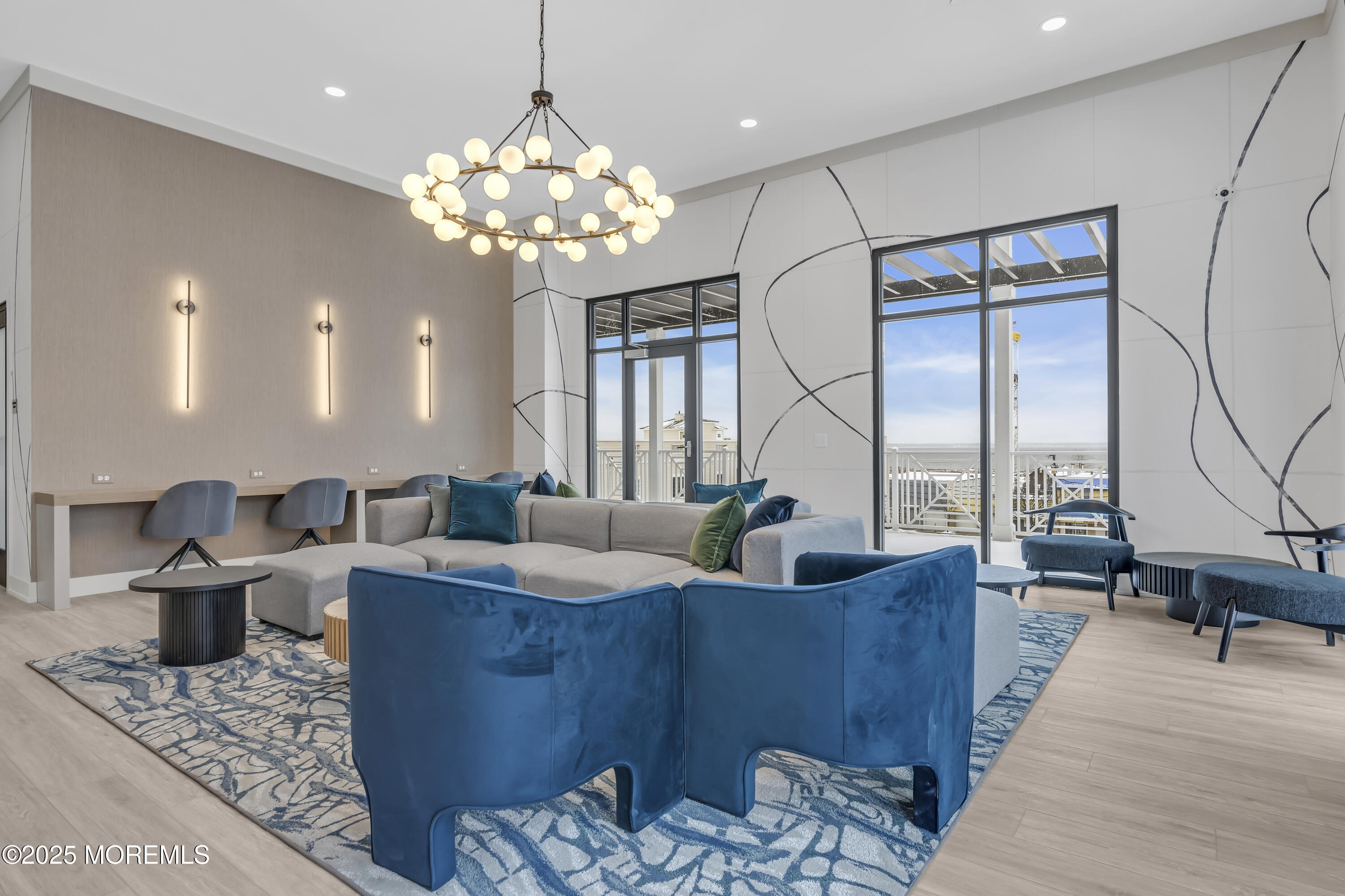 19 Carr Avenue, Unit 414 Keansburg, NJ 07734 - Photo 19 of 83 a living room with couches chandelier and a dining table with wooden floor