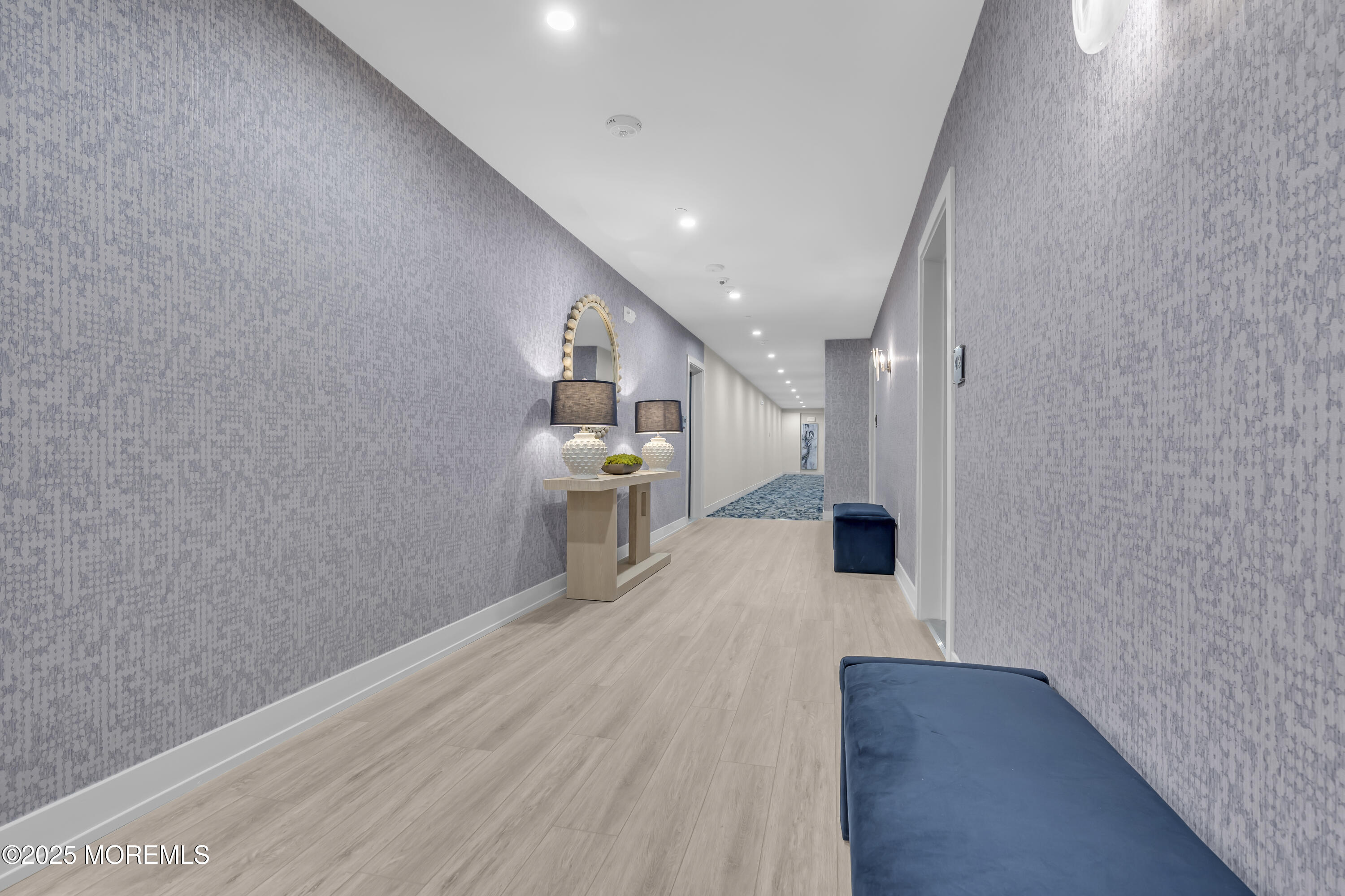 19 Carr Avenue, Unit 414 Keansburg, NJ 07734 - Photo 37 of 83 a view of a hallway with wooden floor