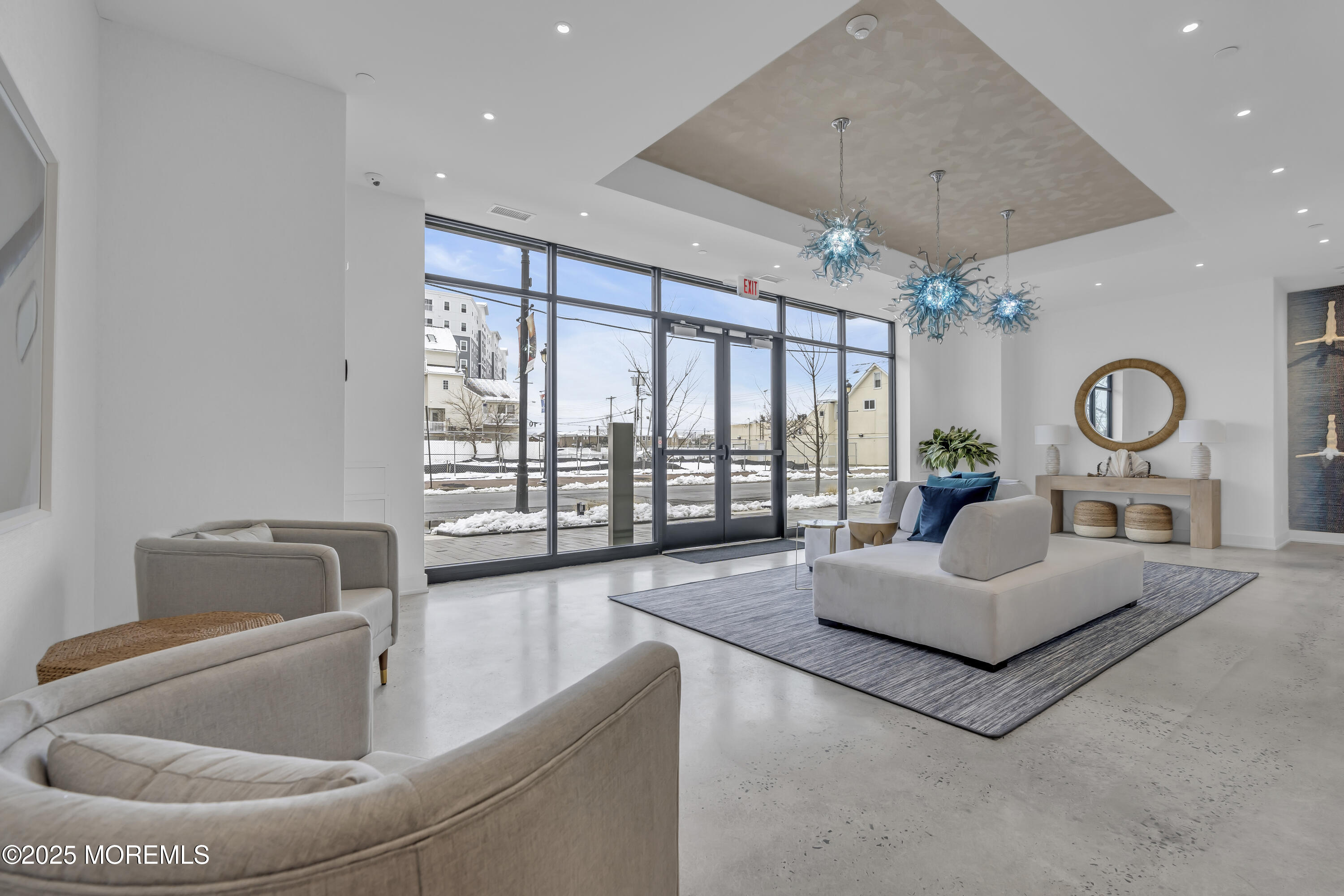 19 Carr Avenue, Unit 414 Keansburg, NJ 07734 - Photo 44 of 83 a living room with furniture and a large window
