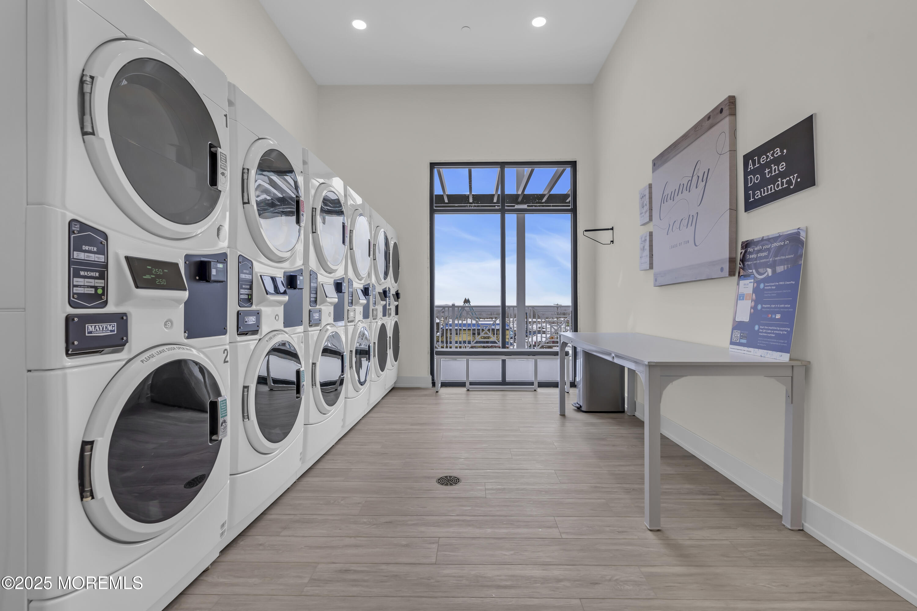 19 Carr Avenue, Unit 414 Keansburg, NJ 07734 - Photo 47 of 83 a view of a hallway with washer and dryer