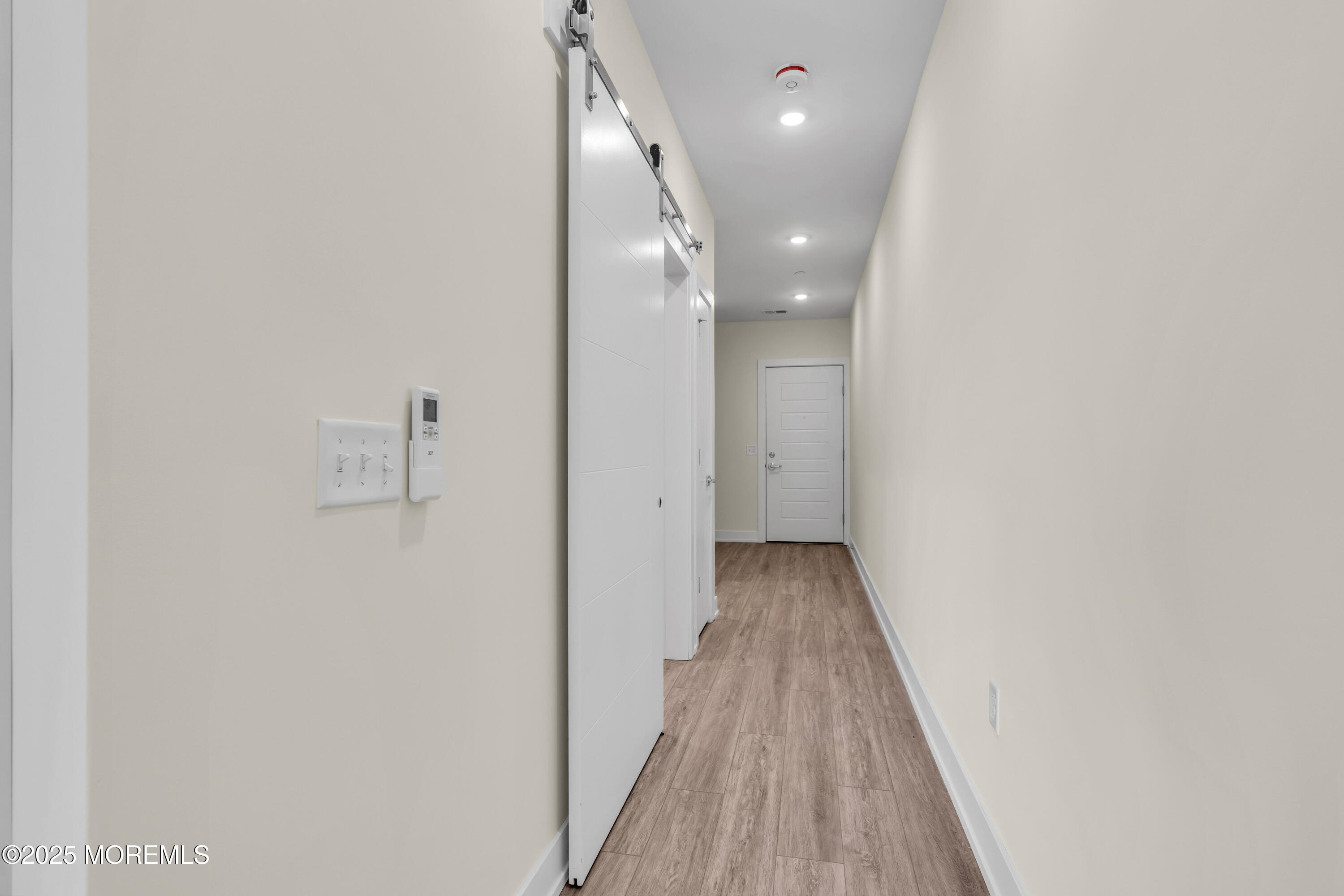 19 Carr Avenue, Unit 414 Keansburg, NJ 07734 - Photo 56 of 83 a view of a hallway with wooden floor