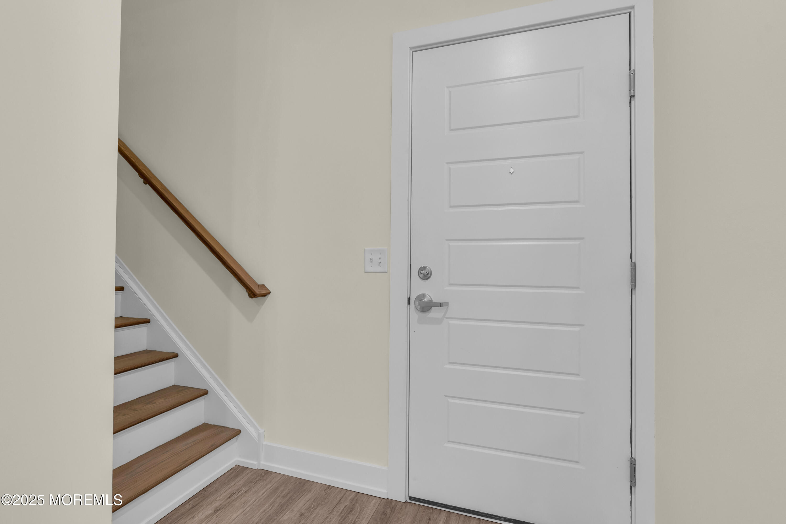 19 Carr Avenue, Unit 414 Keansburg, NJ 07734 - Photo 57 of 83 a view of a hallway with wooden floor and entryway