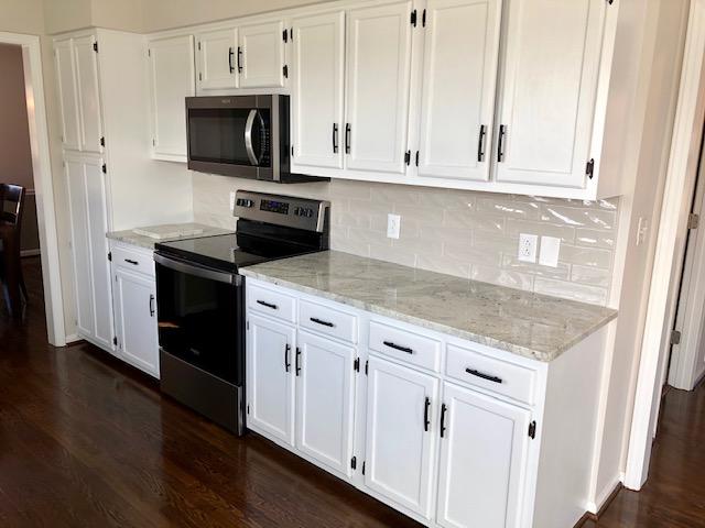 308 North Preston Road Vinton, VA 24179 - Photo 8 of 29 a kitchen with granite countertop white cabinets and stainless steel appliances