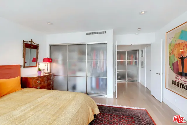 a bedroom with a bed and a television in it