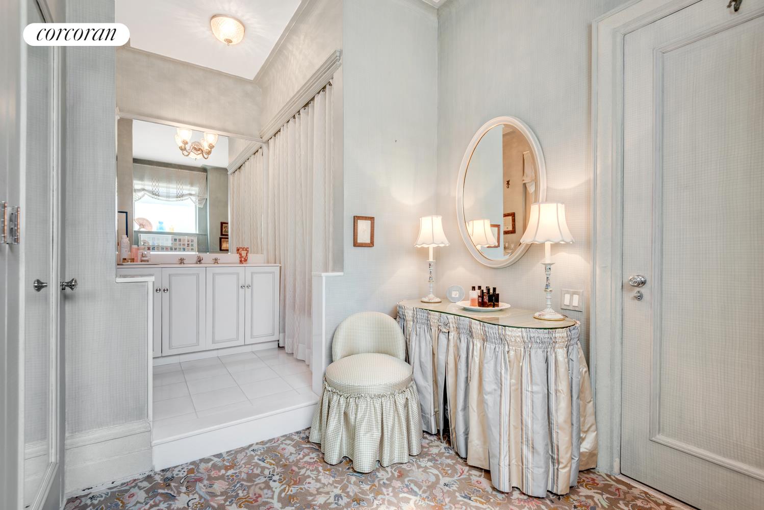 555 Park Avenue, Unit 9E Manhattan, NY 10065 - Photo 10 of 11 a living room with furniture a rug and white walls