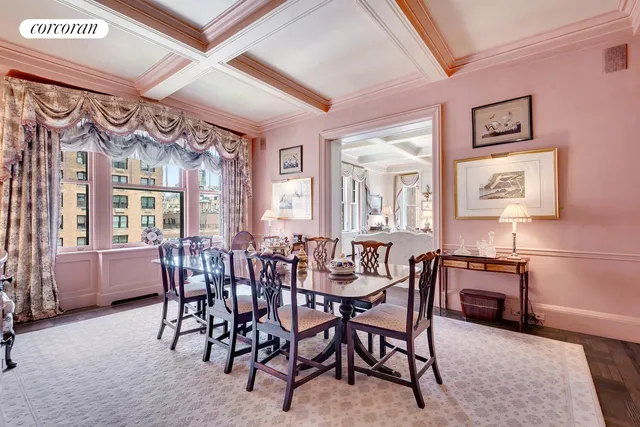 a living room with fireplace furniture and a large window