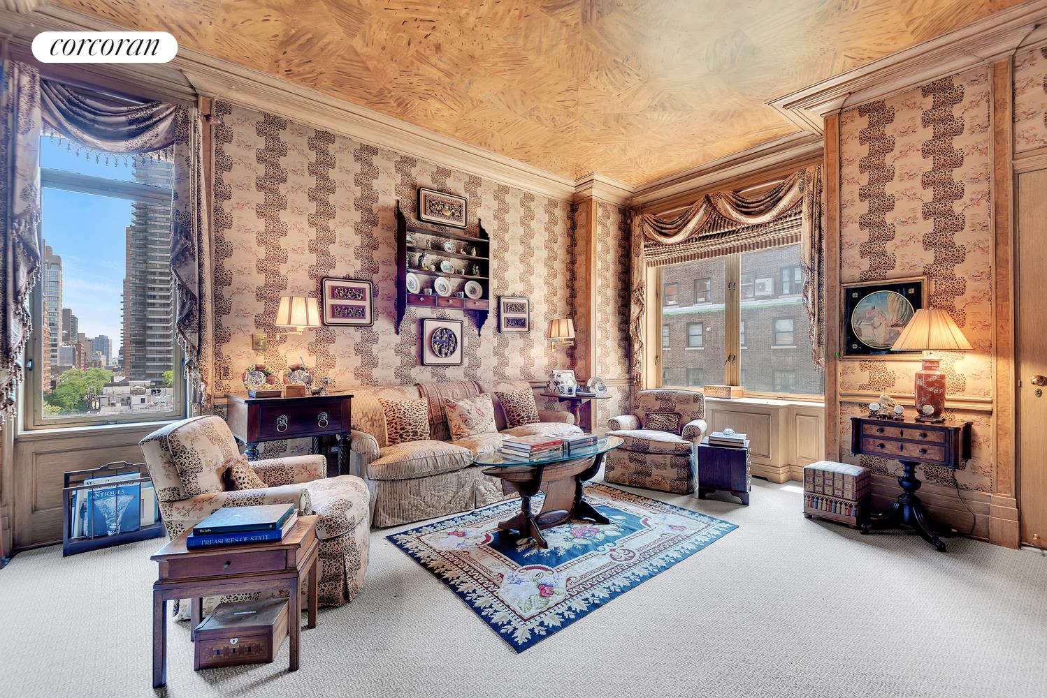 555 Park Avenue, Unit 9E Manhattan, NY 10065 - Photo 4 of 11 a living room with furniture and a fireplace